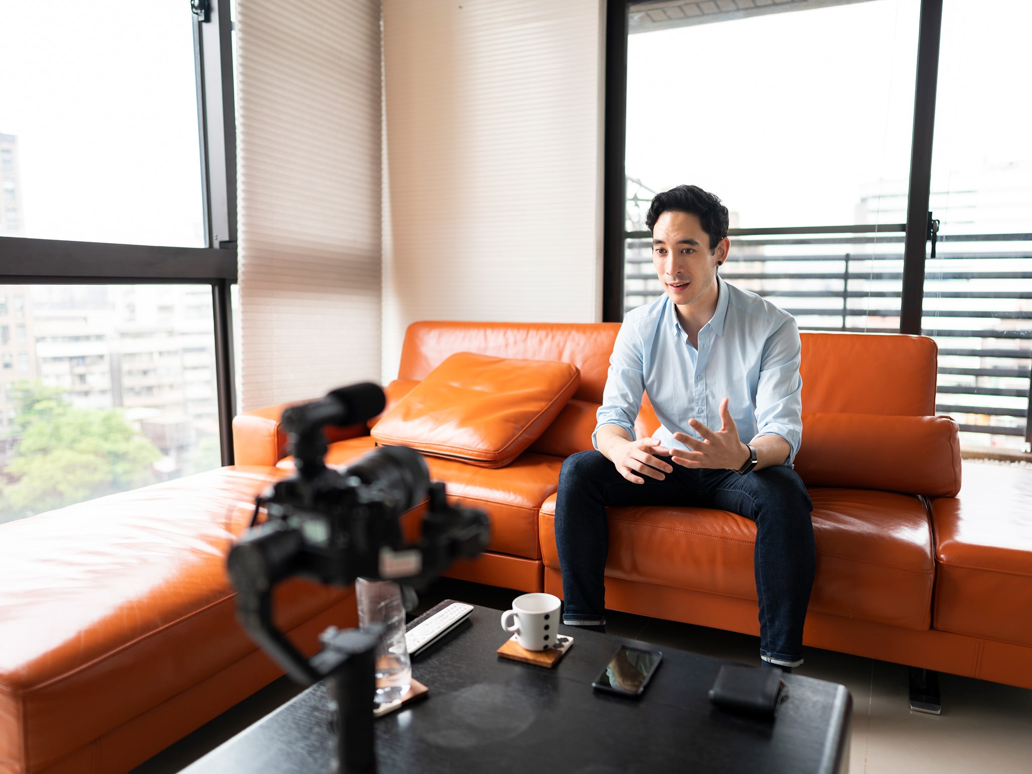 Person broadcasting while sitting on couch