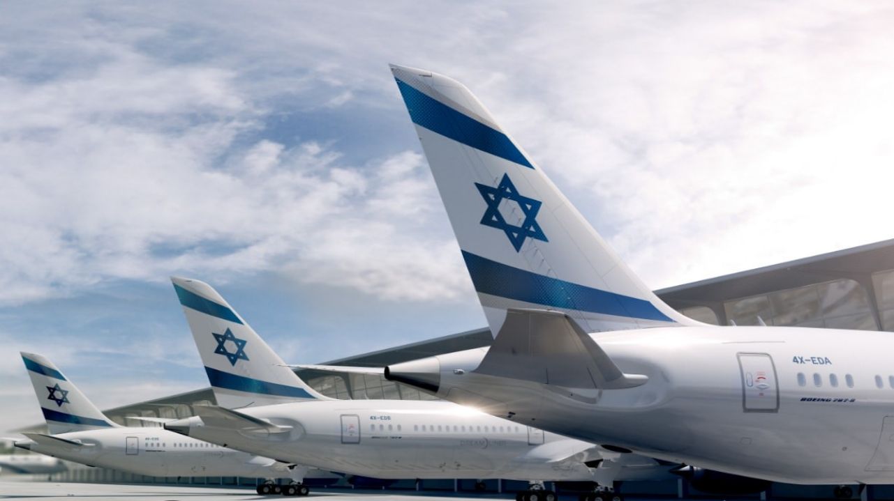 3 jet planes parked at airport terminal with Star of David on the tails