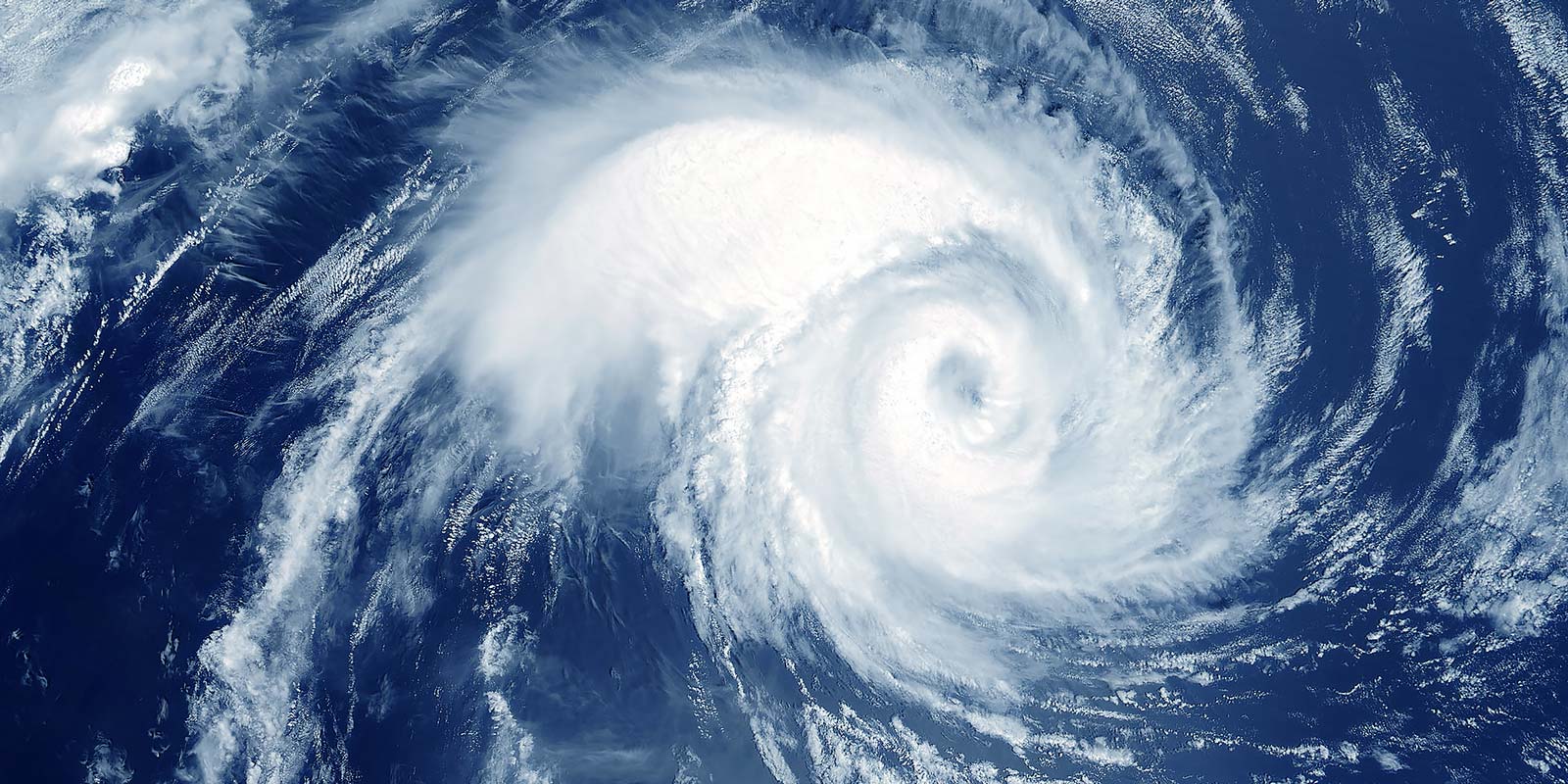 Satellite photo of a hurricane with blue water around it.