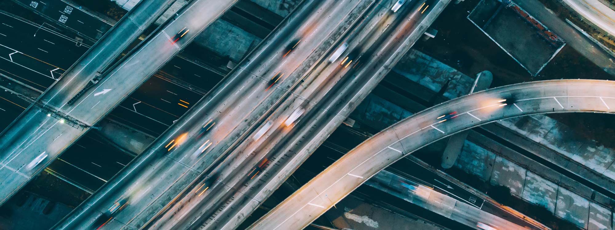 Overhead of interstate with cars driving in blurred motion.