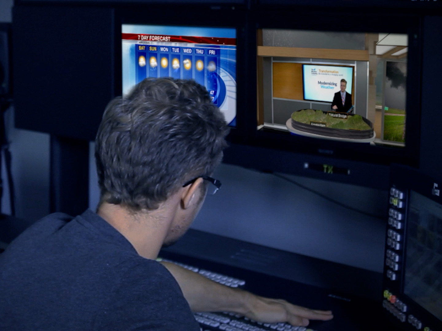 Man using max graphics on a computer with two monitors.