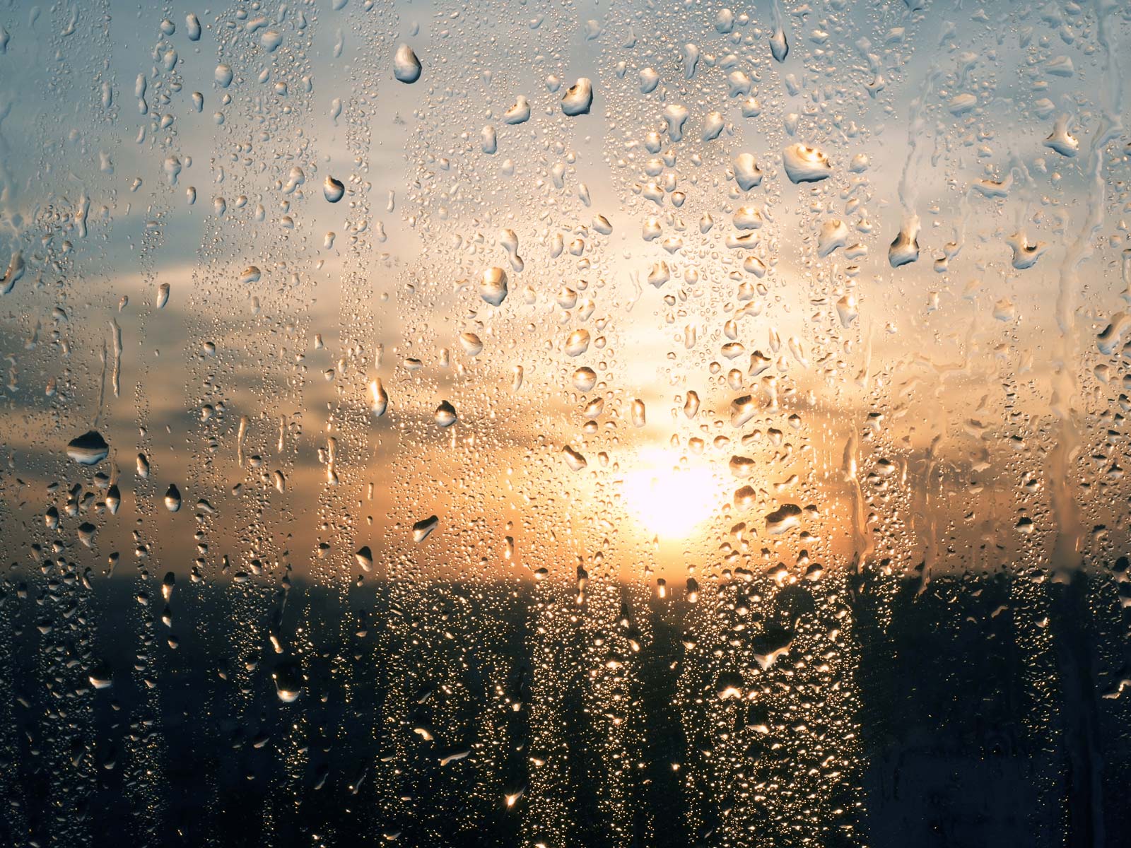 rain-window-sunset-GettyImages-904479214