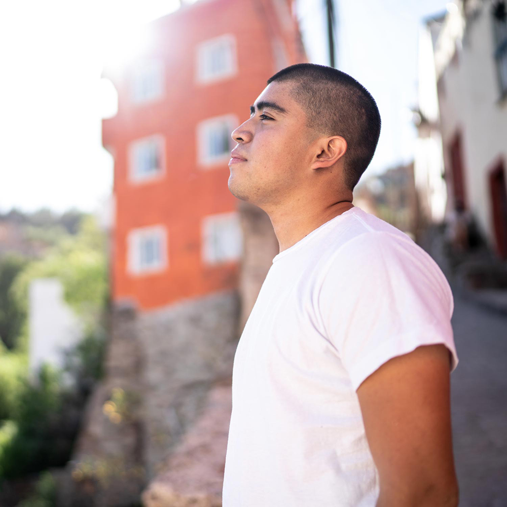 thumb-hispanic-man-outdoor-sun-GettyImages-1311631666