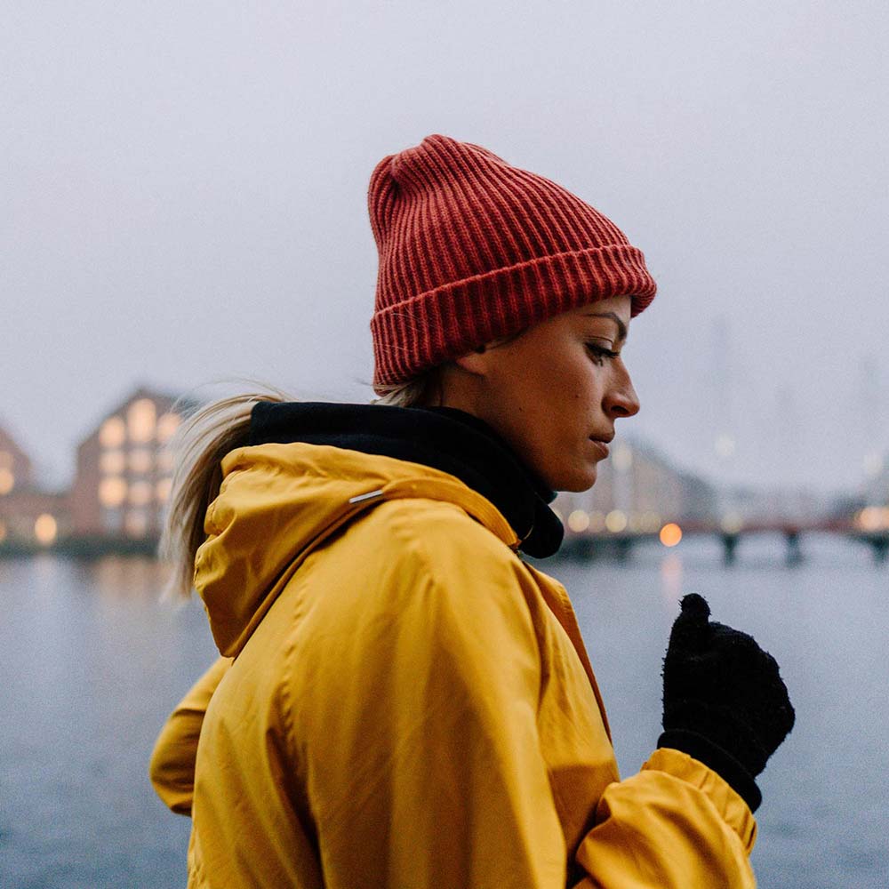 thumb-woman-running-yellow-raincoat-GettyImages-1216163593