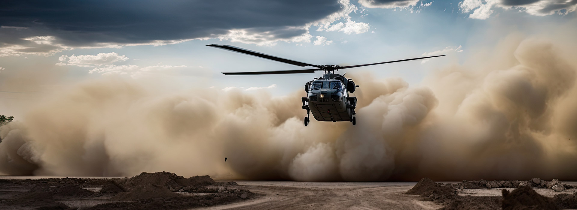 Military helicopter landing in sand storm.