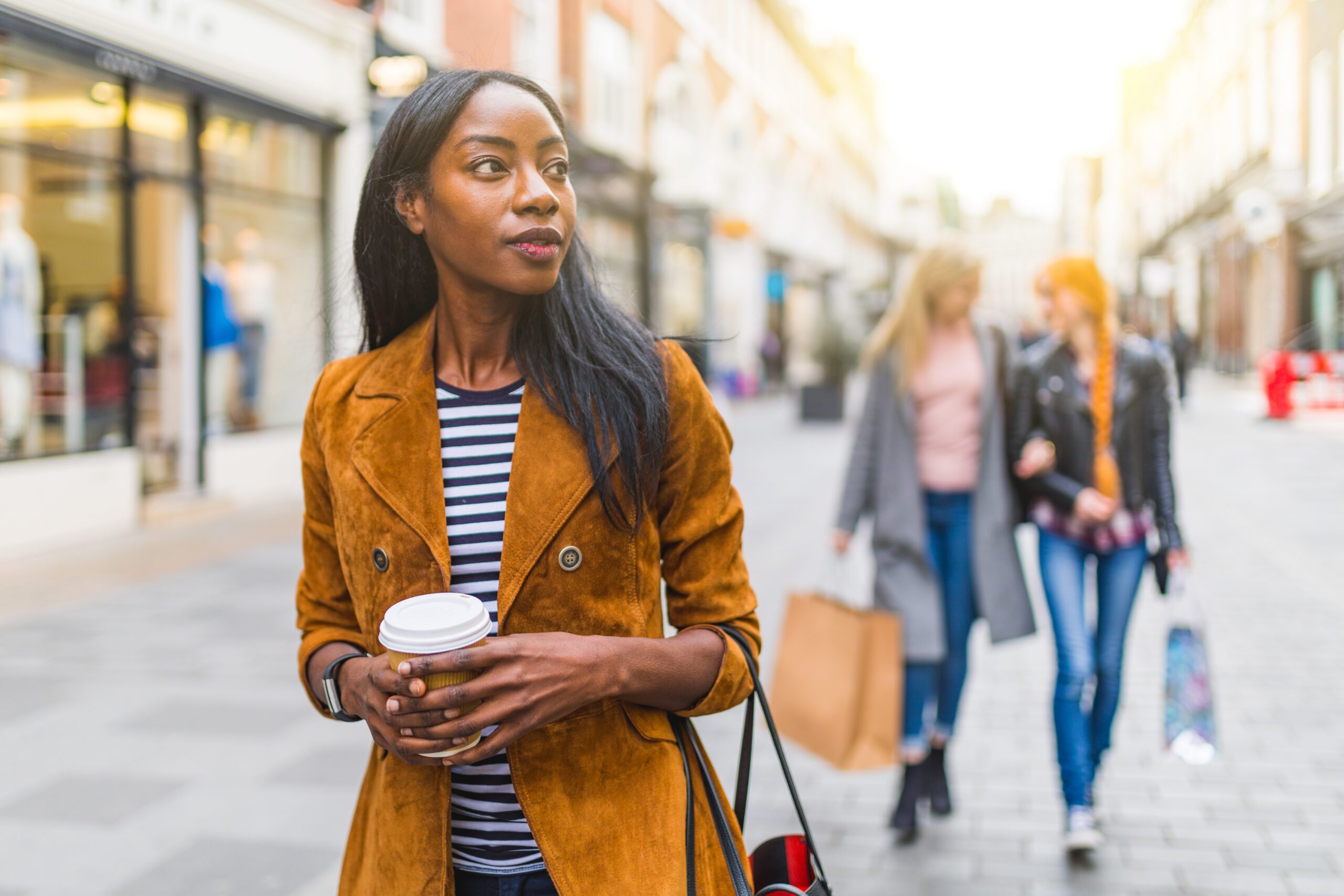 Shoppers in an outdoor retail setting.