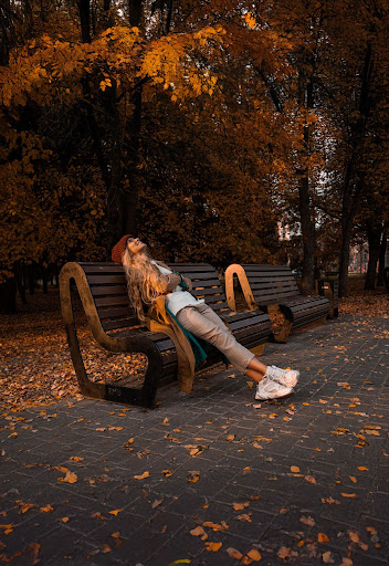 Woman relaxing on a park bench