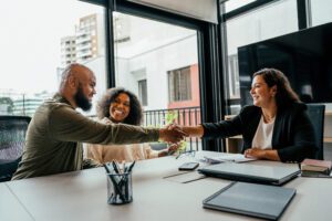 Couple closing deal in an insurance agent office