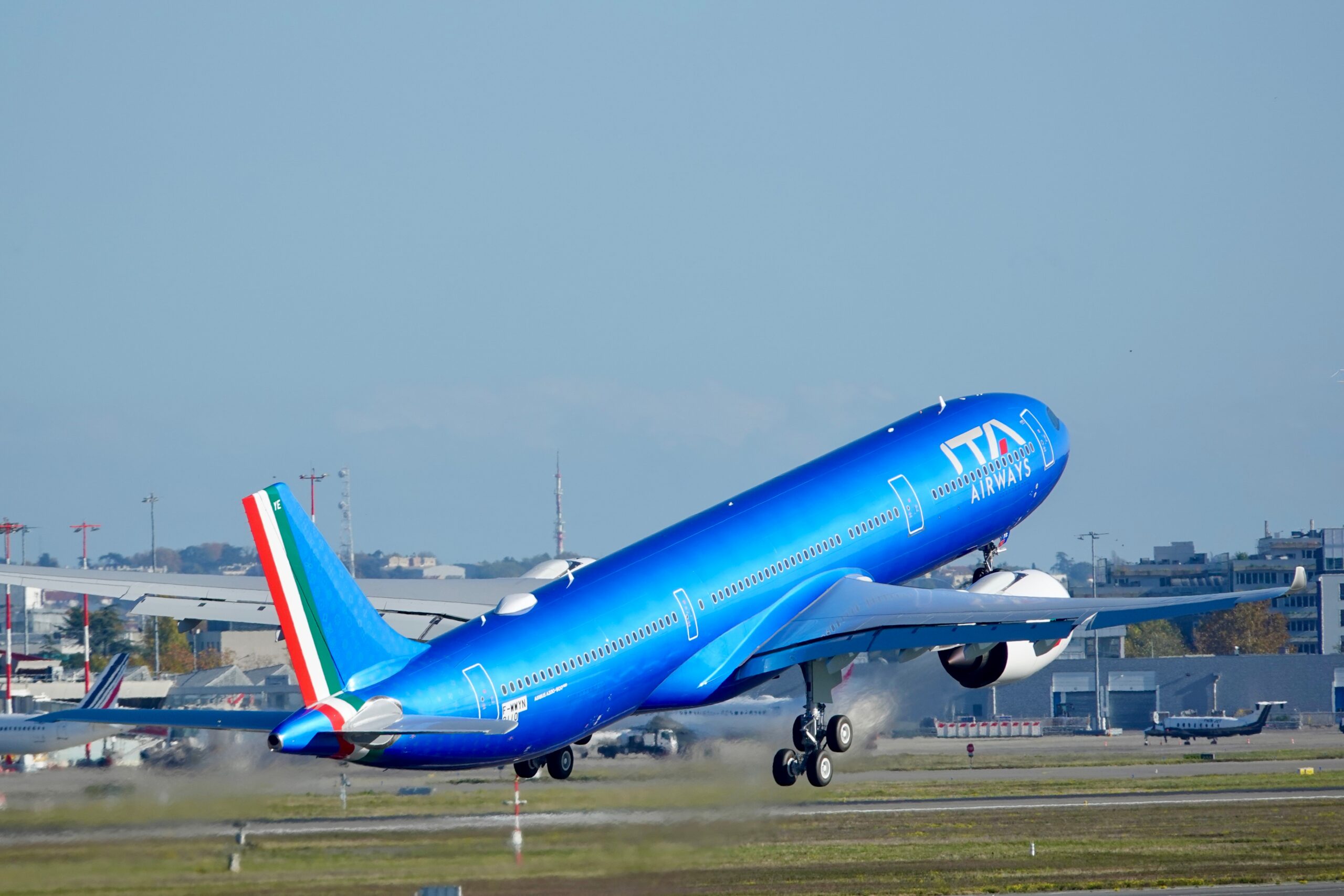 ITA Airways plane on a runway taking off