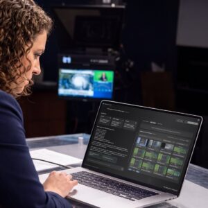 A broadcast meteorologist using Weather Story Assist on her computer to make content.